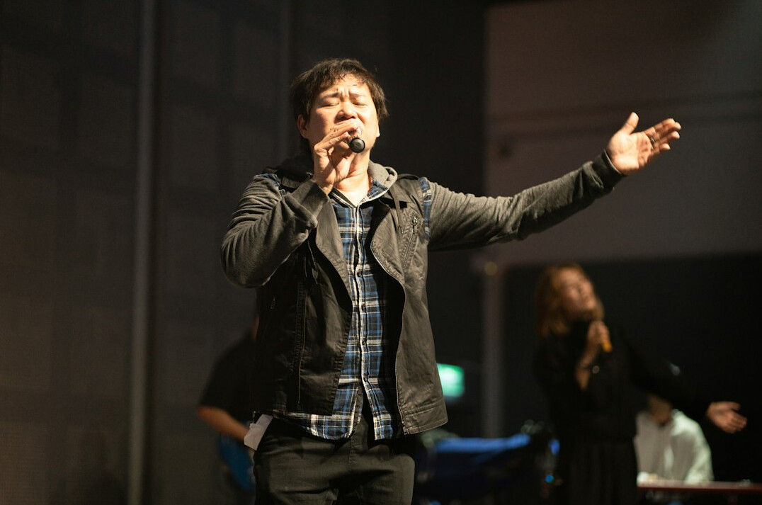 person speaking confidently on stage