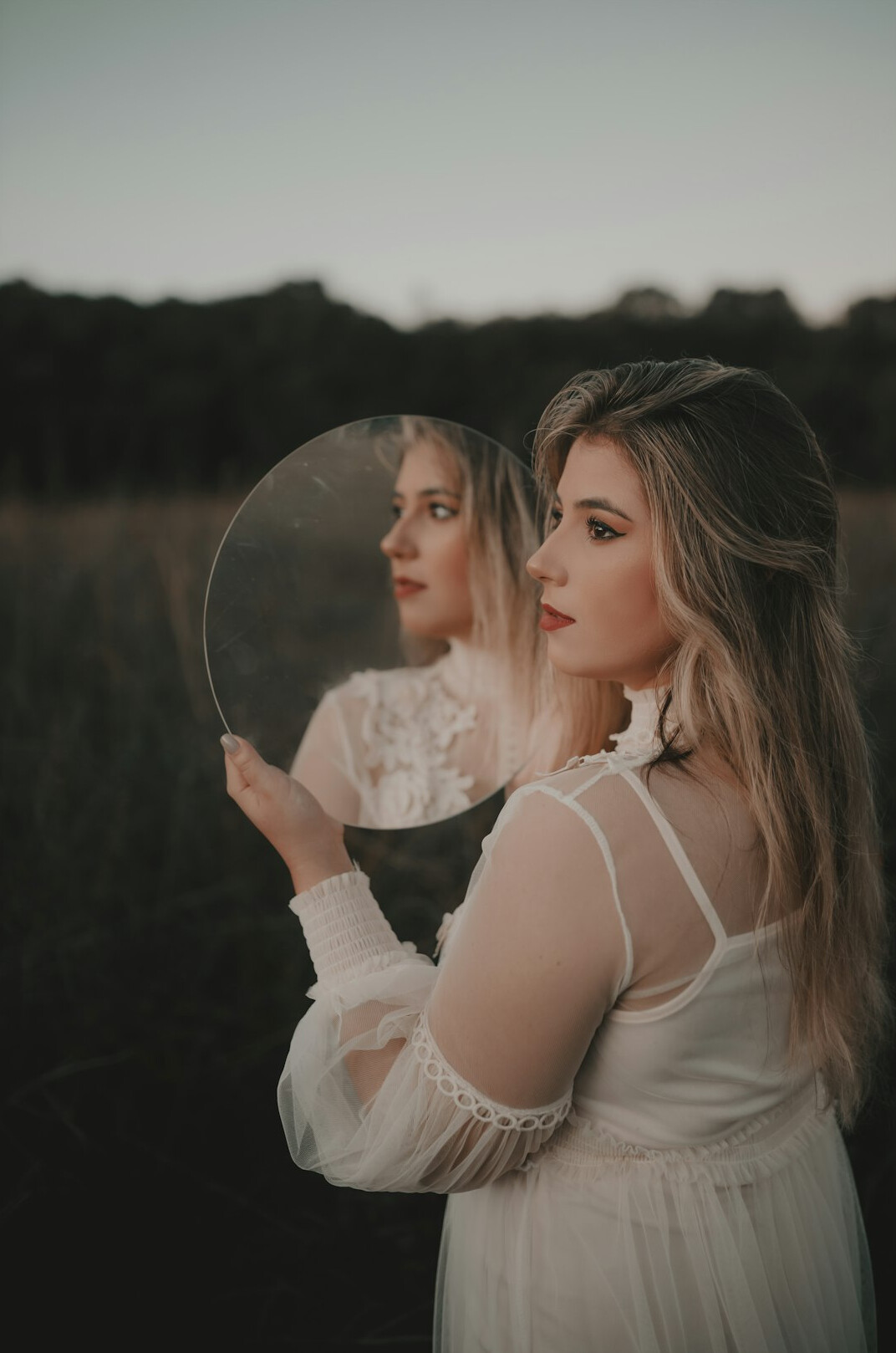 person reflecting in mirror